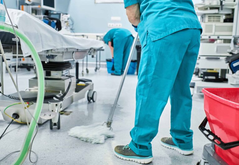 woman-cleaning-staff-mopping-the-floor-of-a-hospital-operating-room.jpg